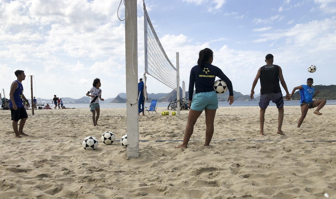 People play footvolley on a beach after Rio de Janeiro on Friday started reopening its beaches for team sports, as well as its tourist attractions, even though Brazil has recorded more than 2 million cases of the novel coronavirus. Photo: Tânia Rêgo/Agencia Brazil/dpa