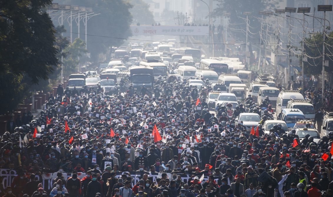 25 December 2020, Nepal, Kathmandu: Supporters of Nepal Communist Party, led by former prime minister Pushpa Kamal Dahal march to the Election Commission during a mass protest against the dissolution of parliament. Photo: Skanda Gautam/ZUMA Wire/dpa