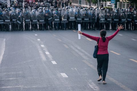 28 March 2021, Thailand, Bangkok: A protester requests the police to allow them demonstrate outside Government House during an anti-government demonstration demanding the resignation of Thai Prime Minister Chan-o-cha and reform of the monarchy. More than 90 pro-democracy protesters were arrested by riot police after dispersing the protesters during the 'Thalufah Village' overnight protest outside Government house. Photo: Peerapon Boonyakiat/SOPA Images via ZUMA Wire/dpa