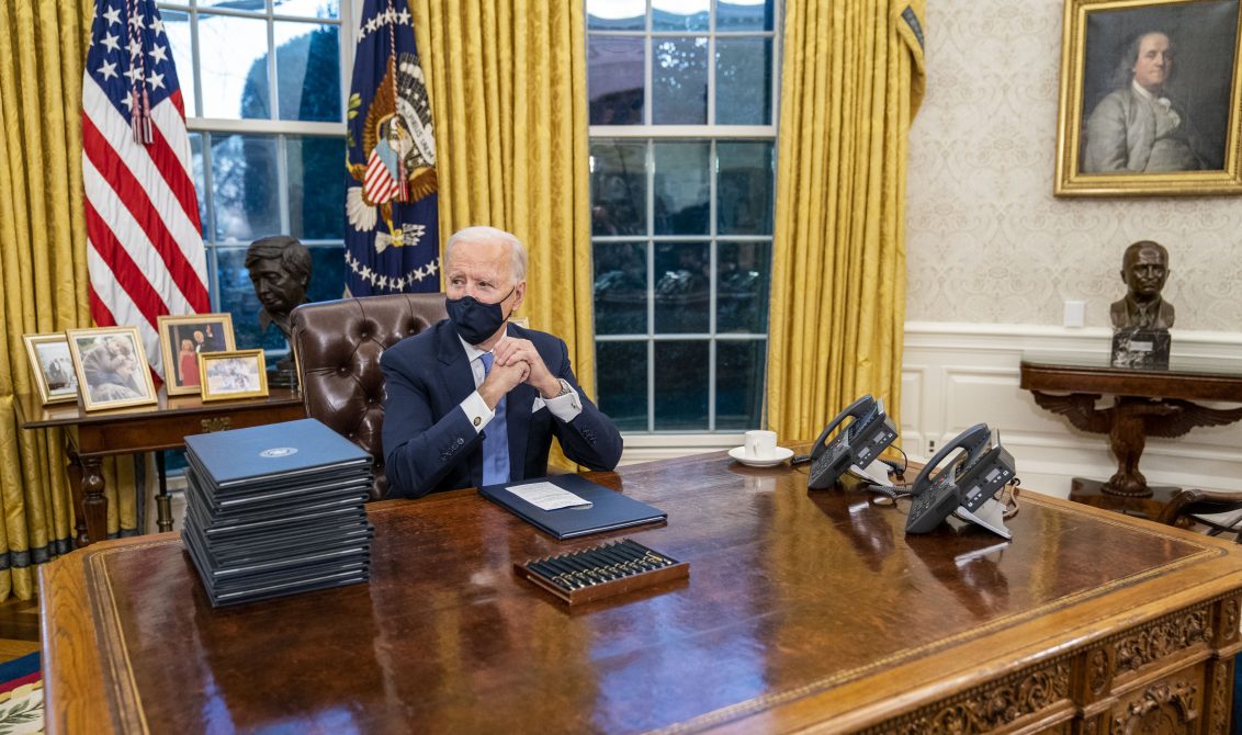 January 20, 2021 - Washington, DC, United States: United States President Joe Biden signs executive order on Covid-19 during his first minutes in the Oval Office, Wednesday, Jan. 20, 2021. President Biden as the 46th president of the United States. (Doug Mills / CNP / Polaris)
