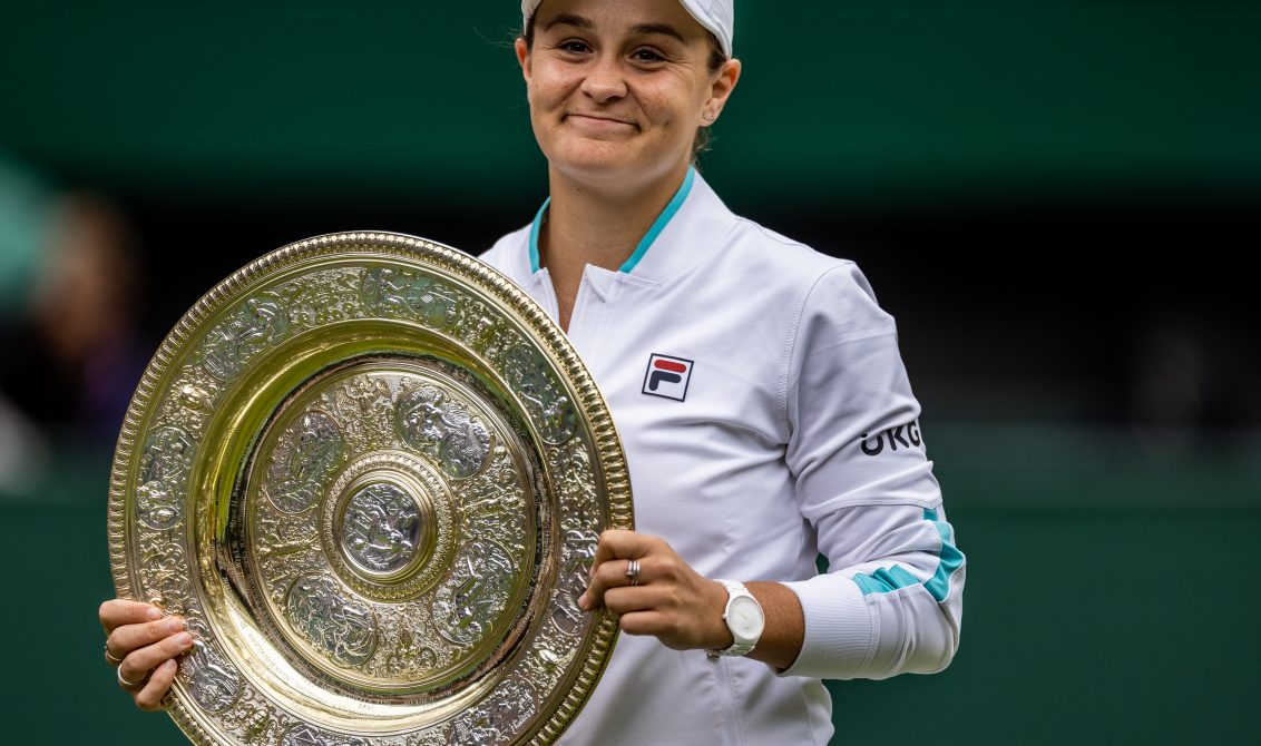 10 July 2021, United Kingdom, London: Australian tennis player Ashleigh Barty celebrates with the trophy after winning the women's singles final match against Czech Republic's Karolina Pliskova on day twelve of the 2021 Wimbledon Tennis Championships at The All England Lawn Tennis and Croquet Club. Photo: Steven Paston/PA Wire/dpa
