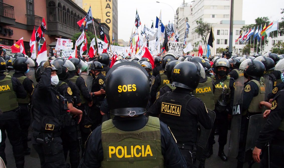 07 December 2021, Peru, Lima: Anti-riot police officers try to contain the crowd during a protest against Peruvian President Castillo and his government. Photo: Carlos Garcia Granthon/ZUMA Press Wire/dpa