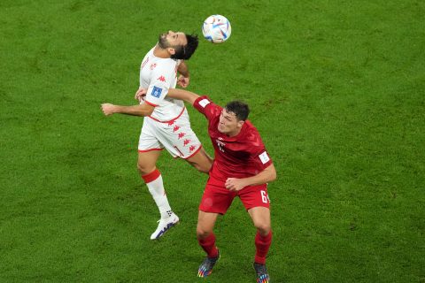 22 November 2022, Qatar, Al Rayyan: Tunisia's Taha Yassine Khenissi (L) and Denmark's Andreas Christensen battle for the ball during the FIFA World Cup Qatar 2022 Group D soccer match between Denmark and Tunisia at the Education City Stadium. Photo: Martin Rickett/PA Wire/dpa
