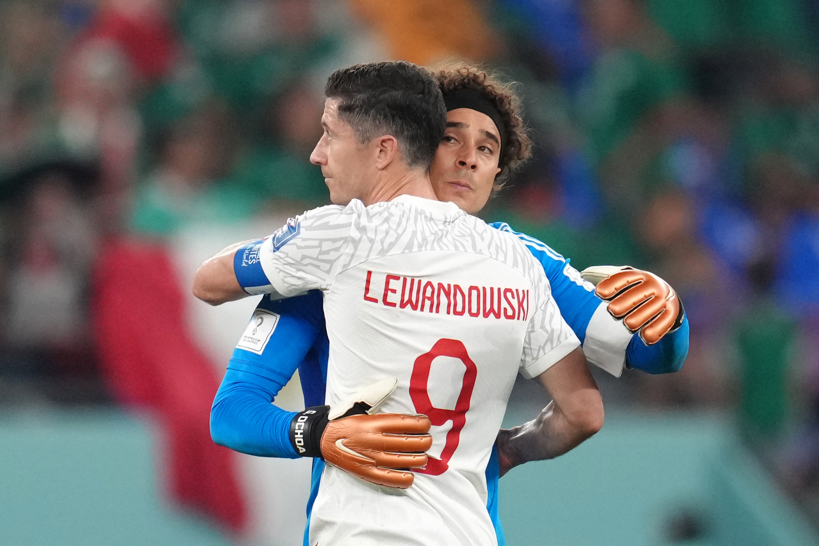 22 November 2022, Qatar, Doha: Poland's Robert Lewandowski greets Mexico goalkeeper Guillermo Ochoa following the FIFA World Cup Qatar 2022 Group C soccer match between Mexico and Poland at Stadium 974. Photo: Nick Potts/PA Wire/dpa