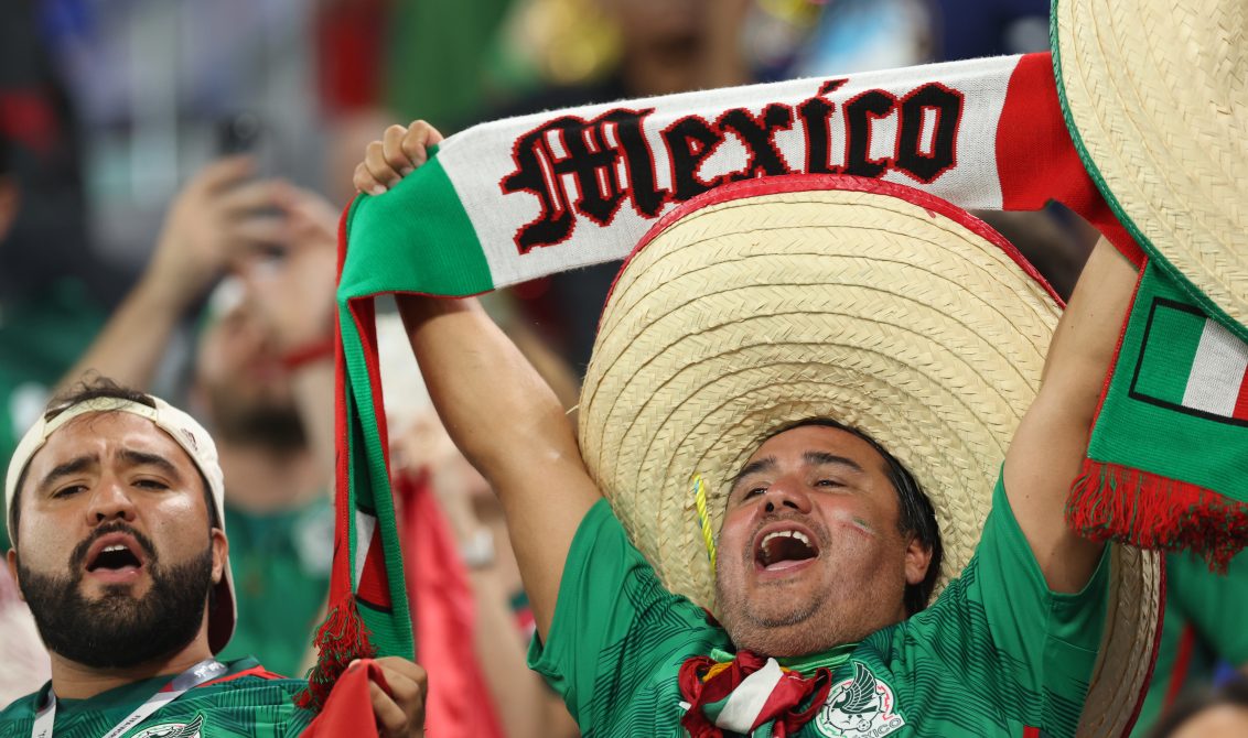22 November 2022, Qatar, Doha: Fans of Mexico cheer in the stands ahead of the FIFA World Cup Qatar 2022 Group C soccer match between Mexico and Poland at Stadium 974. Photo: Christian Charisius/dpa