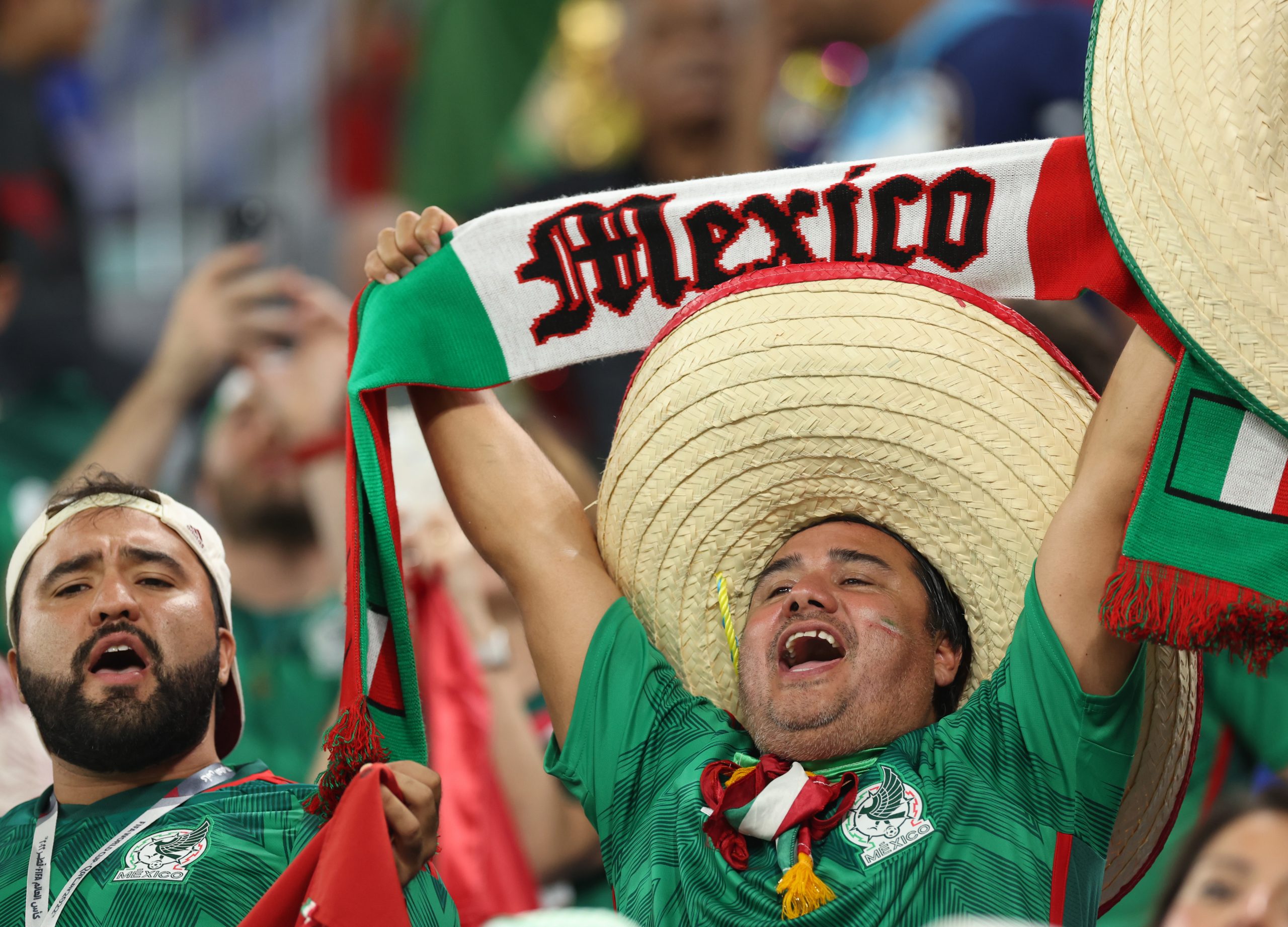 22 November 2022, Qatar, Doha: Fans of Mexico cheer in the stands ahead of the FIFA World Cup Qatar 2022 Group C soccer match between Mexico and Poland at Stadium 974. Photo: Christian Charisius/dpa