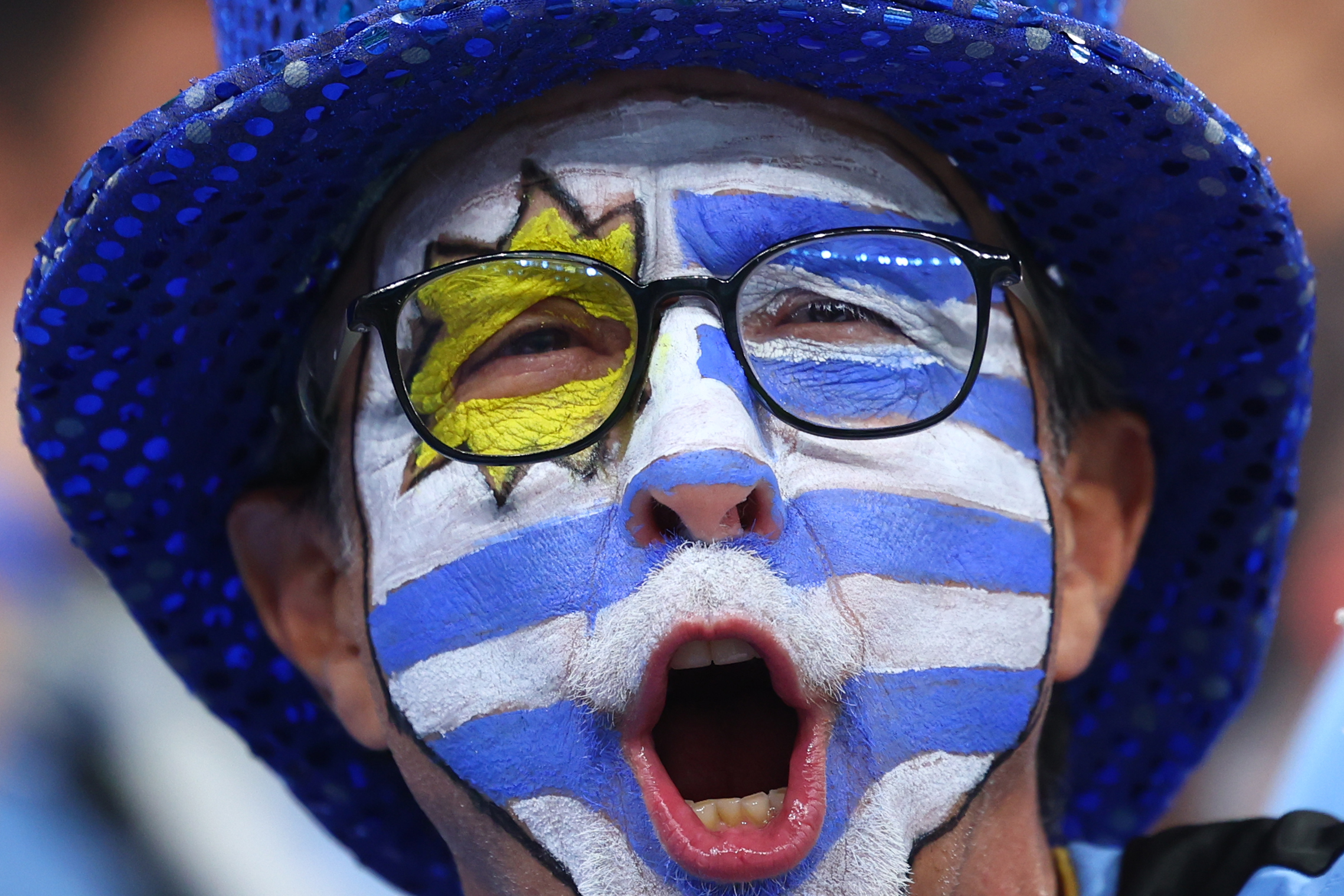 28 November 2022, Qatar, Lusail: An Uruguay fan cheers in the stands prior to the start of the FIFA World Cup Qatar 2022 Group H soccer match between Portugal and Uruguay at Lusail Stadium. Photo: Tom Weller/dpa