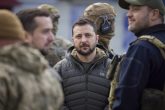 14 November 2022, Ukraine, Kherson: Ukrainian President Volodymyr Zelensky surrounded by security, takes a walk around the city to view the destruction and greet residents during a surprise visit to the liberated regional capital. Photo: -/Planet Pix via ZUMA Press Wire/dpa
