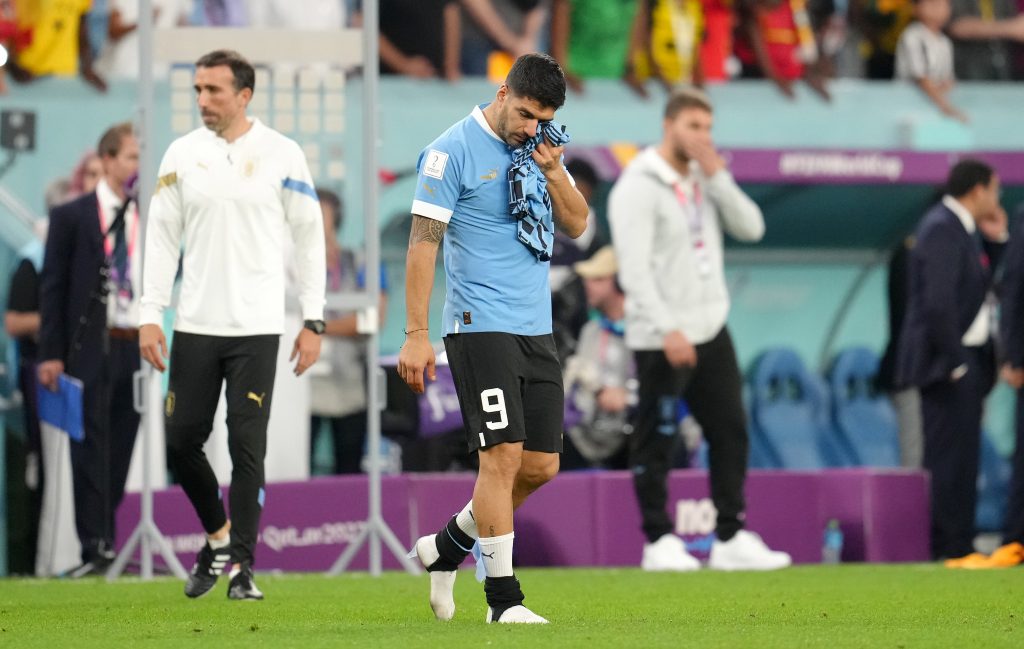 02 December 2022, Qatar, Al-Wakrah: Uruguay's Luis Suarez reacts in frustration after his side's exit from the group stage despite their 2-0 win, after the final whistle of the FIFA World Cup Qatar 2022 Group H soccer match between Ghana and Uruguay at Al Janoub Stadium. Photo: Nick Potts/PA Wire/dpa