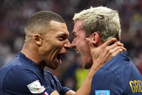 10 December 2022, Qatar, Al Khor: France's Kylian Mbappe and Antoine Griezmann celebrates their sides second goal scored by Olivier Giroud during the FIFA World Cup Qatar 2022 Quarter-Final soccer match between England and France at the Al Bayt Stadium. Photo: Mike Egerton/PA Wire/dpa