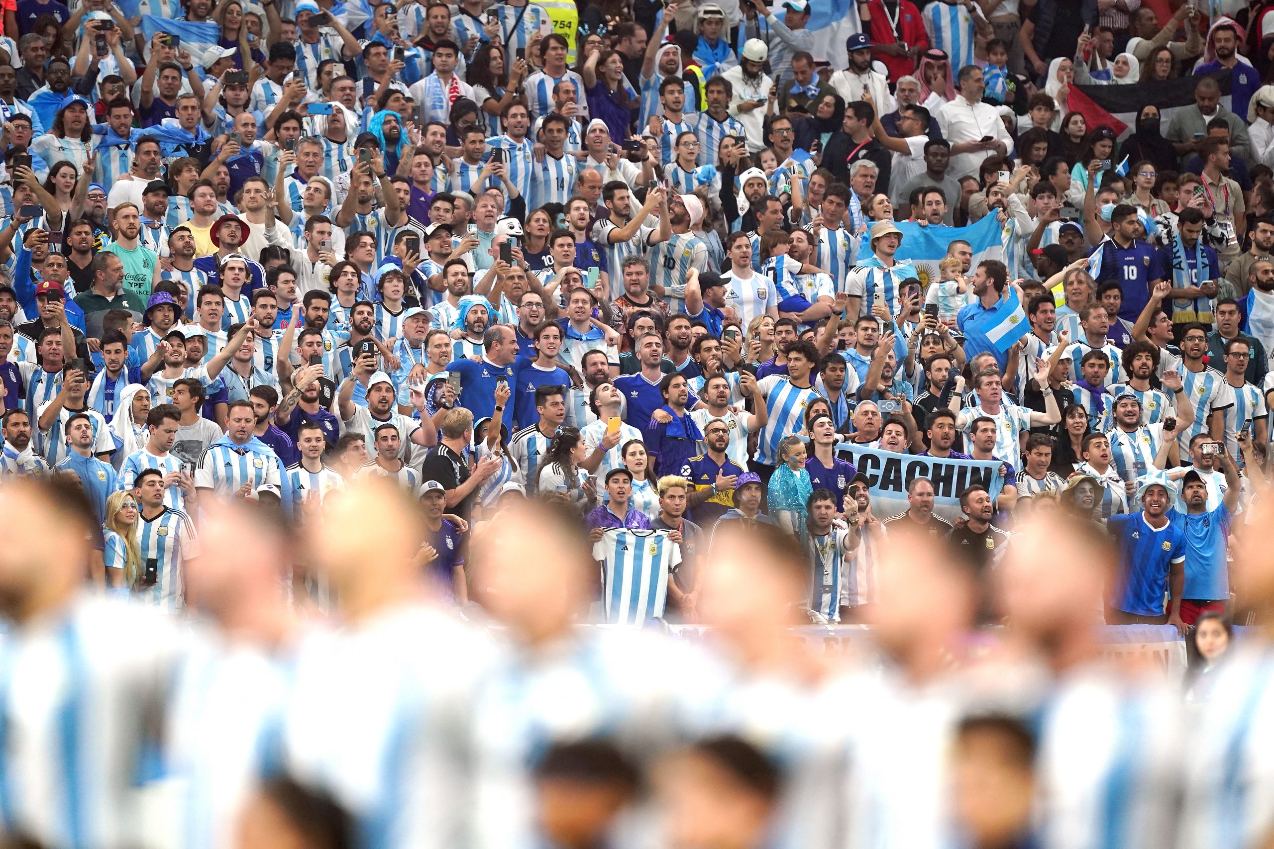 13 December 2022, Qatar, Lusail: Argentina fans cheer as players line up during the national anthem prior to the start of the FIFA World Cup Qatar 2022 semi final soccer match between Argentina and Croatia at the Lusail Stadium. Photo: Mike Egerton/PA Wire/dpa